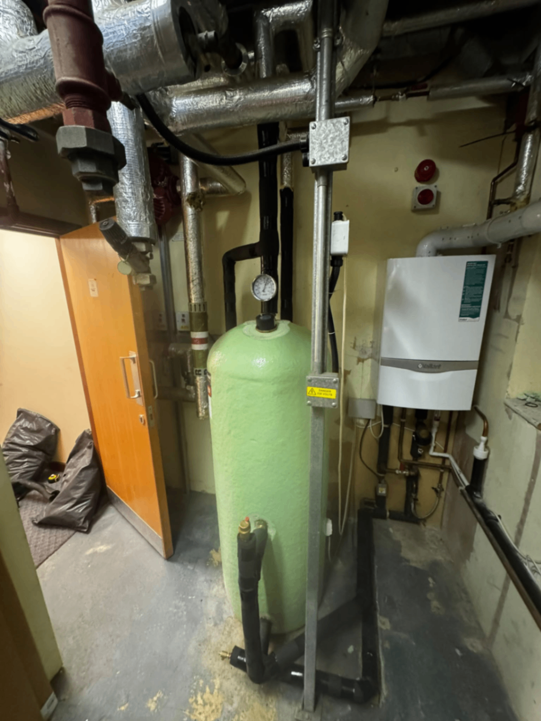 Plant room expansion vessel and Vaillant boiler installation with insulated services and pressure gauge